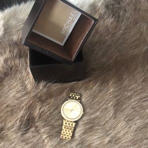 Michael Kors gold diamond watch.